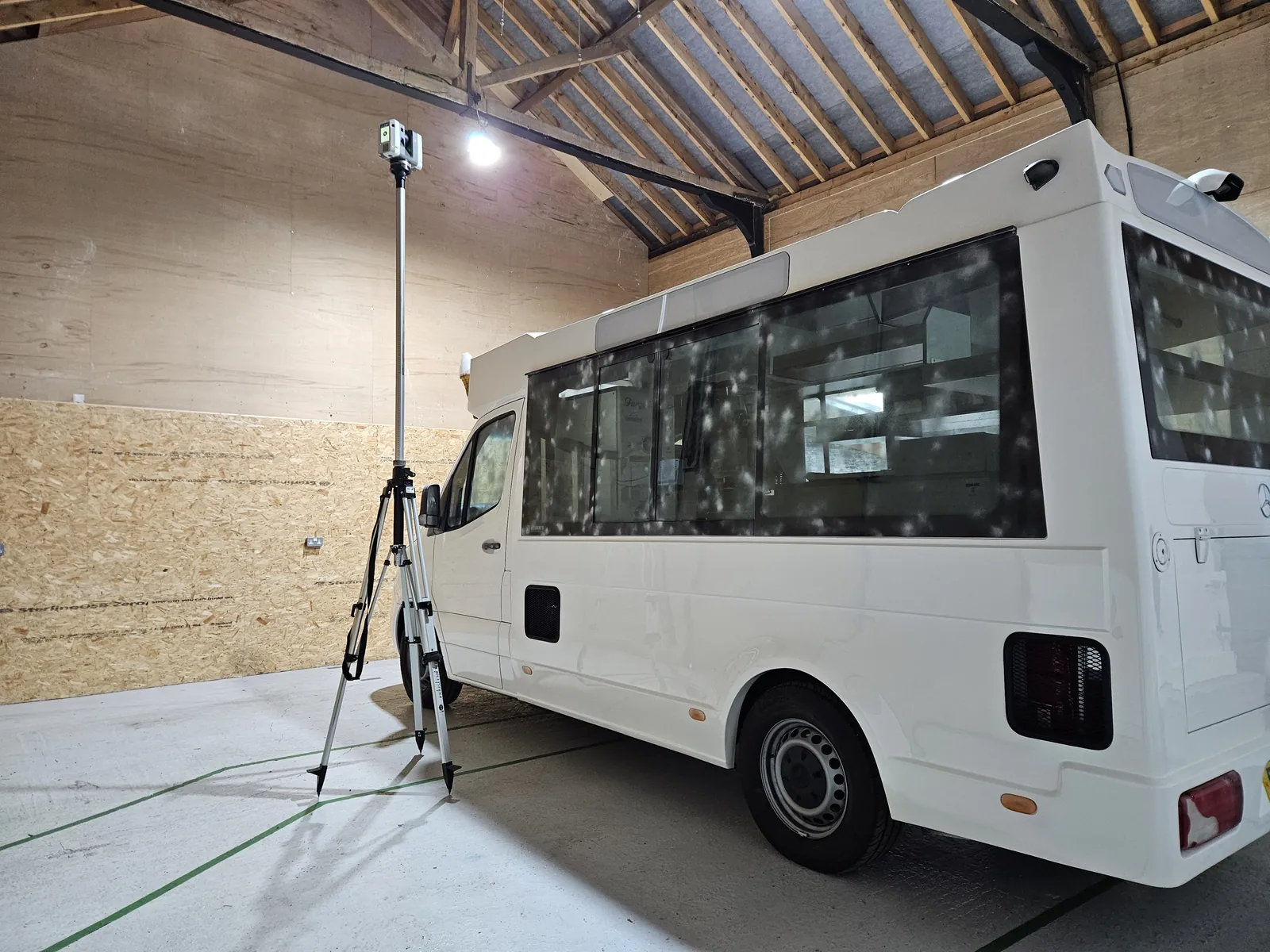 Artec Ray II scanning the side of the van from the far corner of the bay