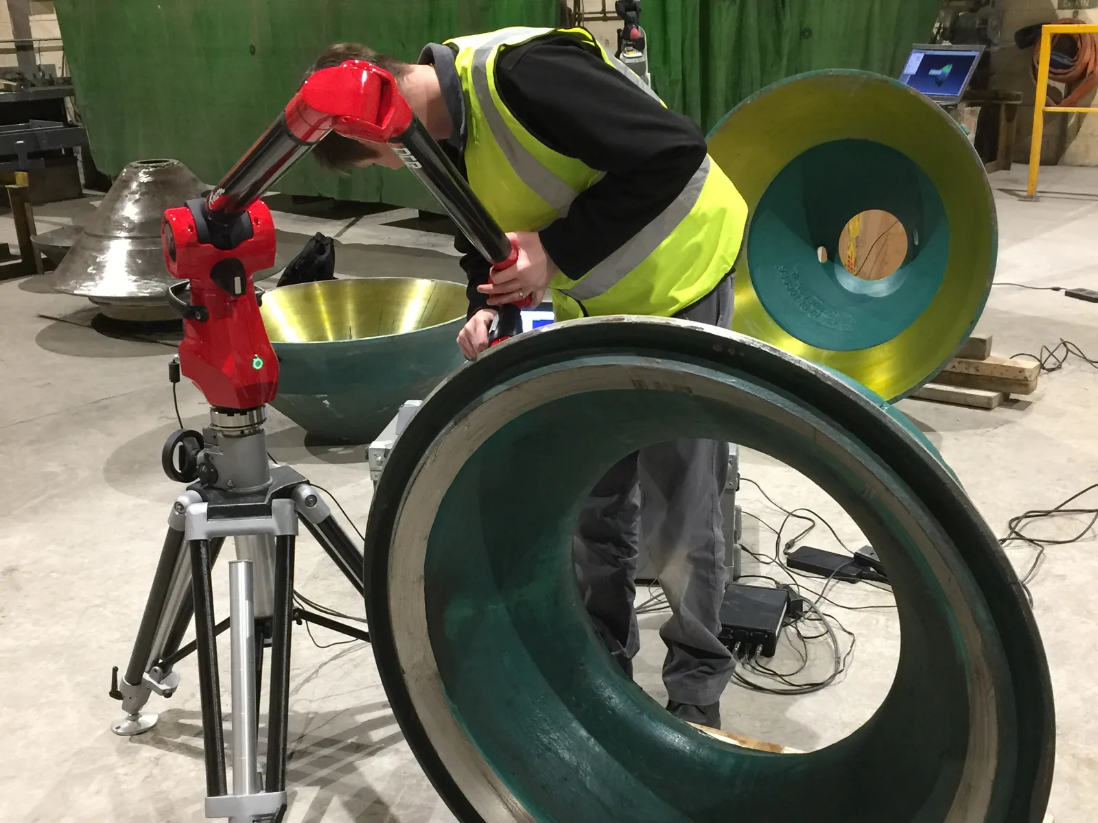 One of our engineers probing a large casting with a Kreon Ace arm on a tripod