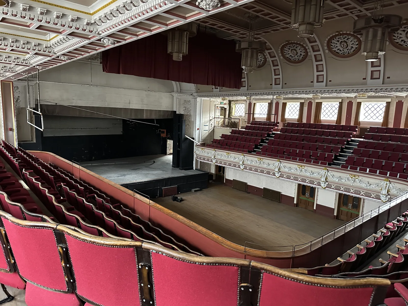 The Queen's Theatre auditorium from the balcony, with the stage and stalls below